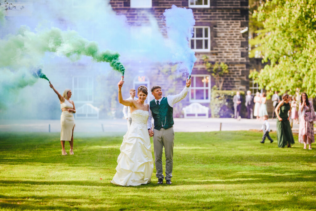 Newly married couple holds a smoke bomb at wedding in Newcastle.